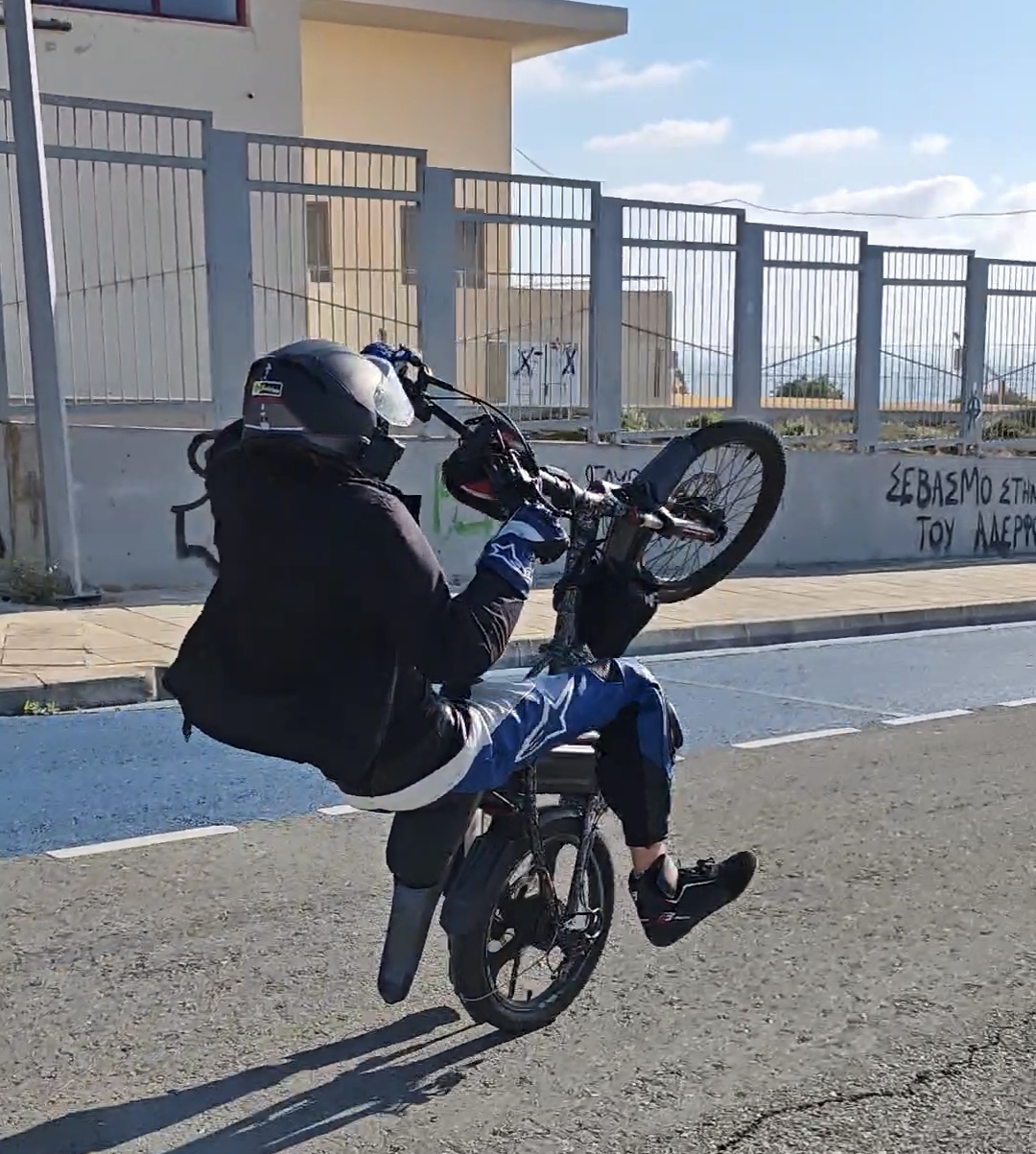 EbikeStr performing a wheelie on the stunt bike